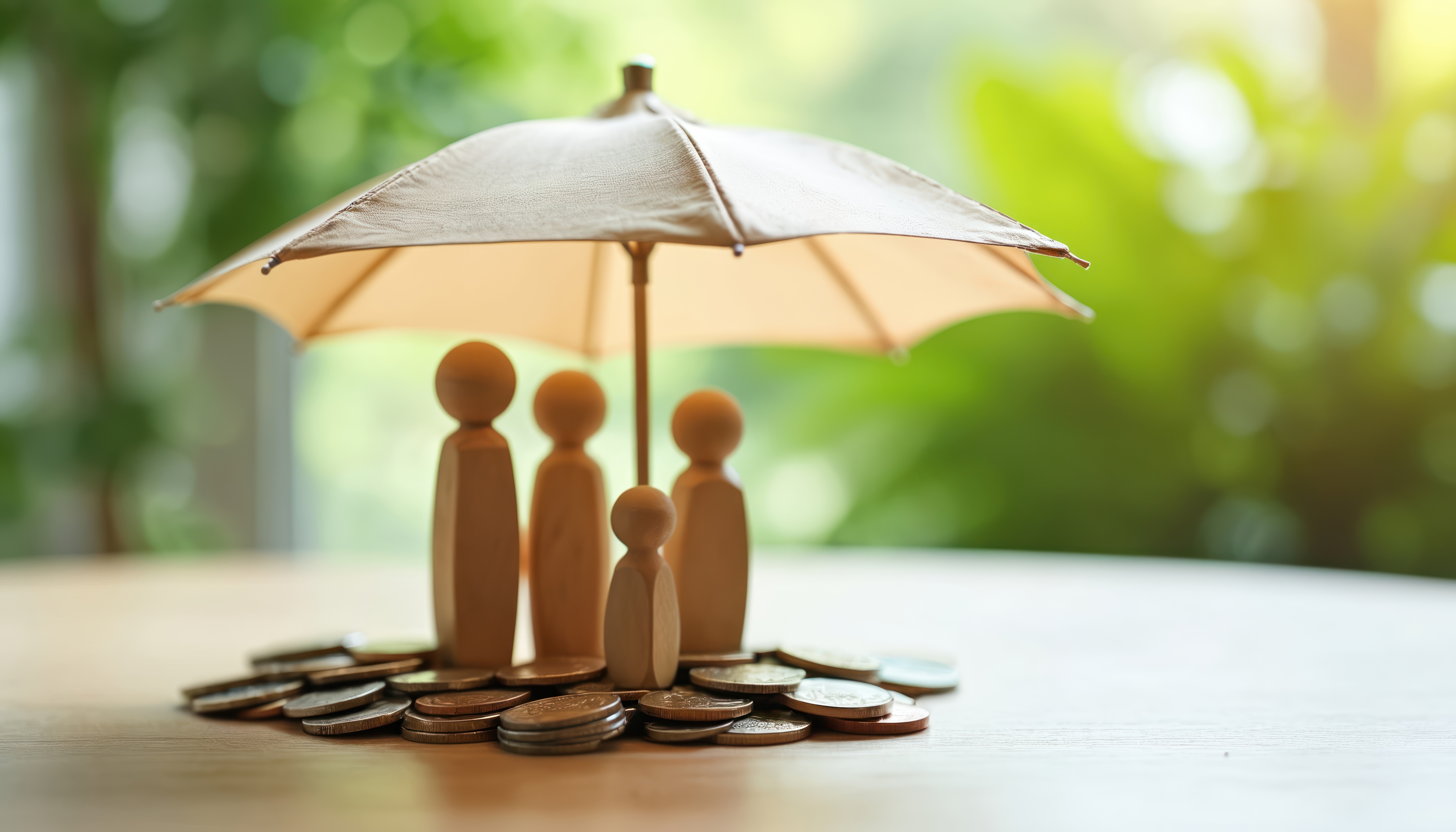 Family caregivers protected under an umbrella representing early caregiver engagement, caregiver education, healthy aging, and community support for older adults.